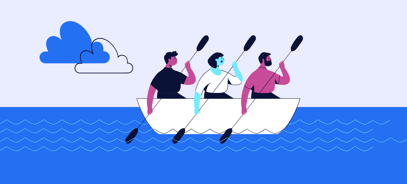Team rowing together in boat