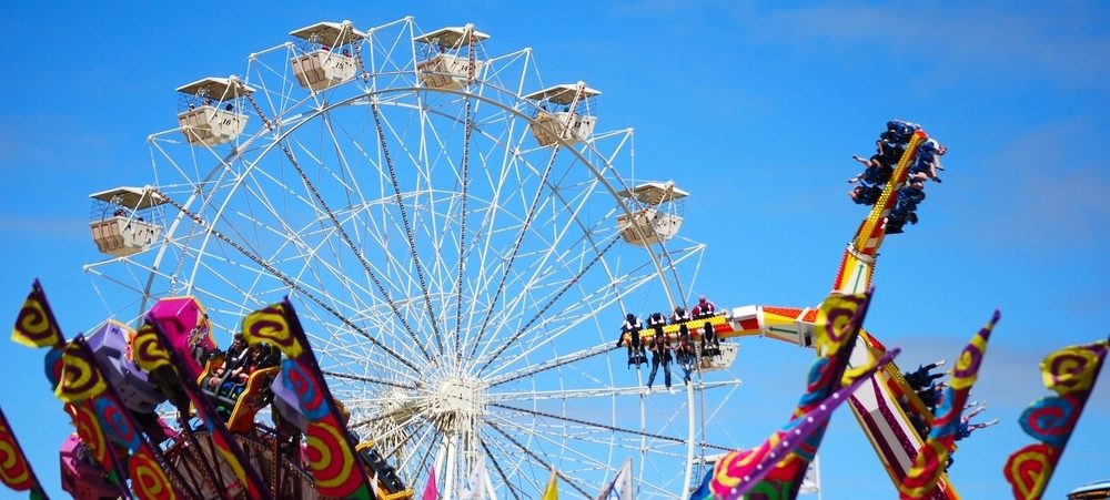 Ferris wheel and other showground rides at a fair