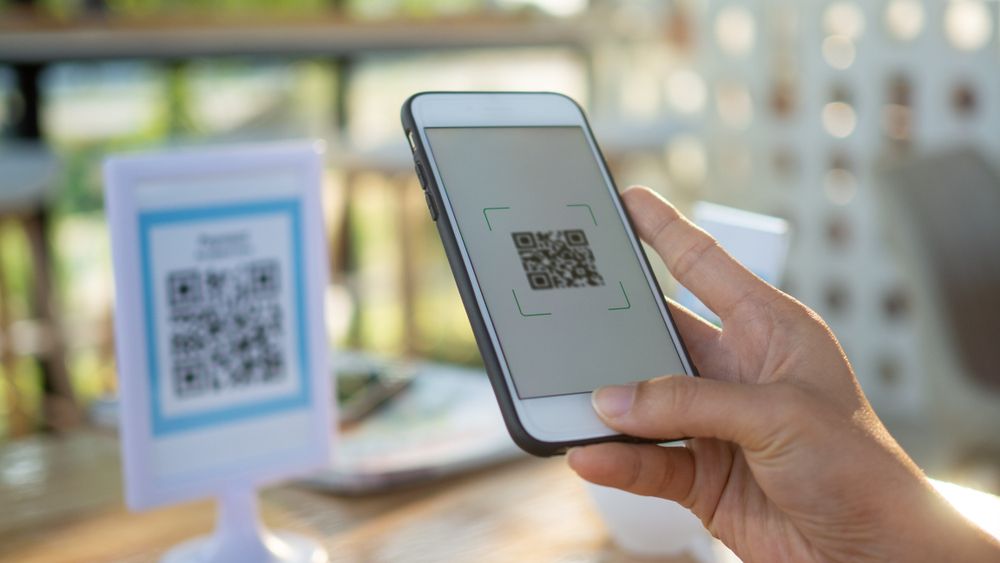 Customer placing an order on their mobile phone using a QR code